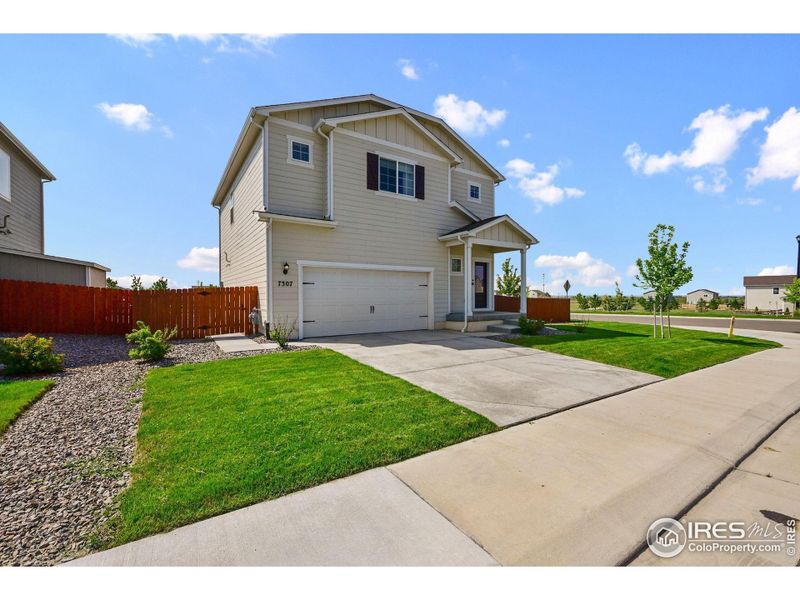 Front exterior of a new home in Hidden Creek, Frederick, CO, highlighting curb appeal (Image 20).
