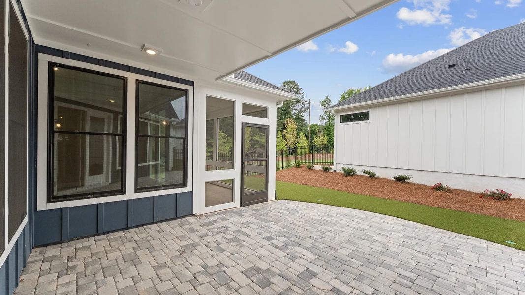 Exterior details and patio area of a home in The Courtyards at Redbud Lane, Canton (Image 13).