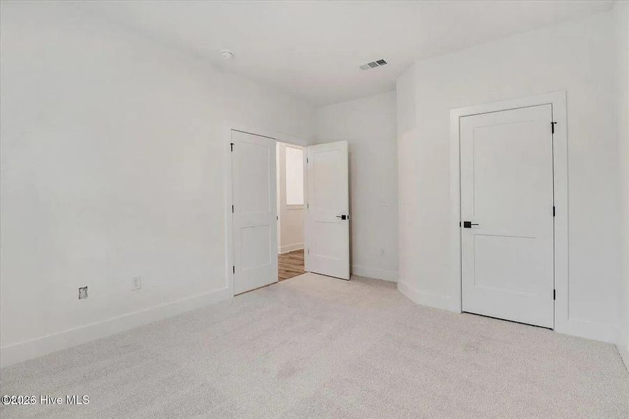 Spacious, unfurnished interior of a new home in East Lake, Leland (Image 15).