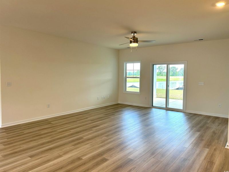 Unfurnished room with a ceiling fan and wood finished floors