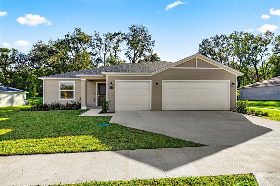 Front exterior of a new home in Marion Ranch, Ocala, FL, highlighting curb appeal (Image 15).