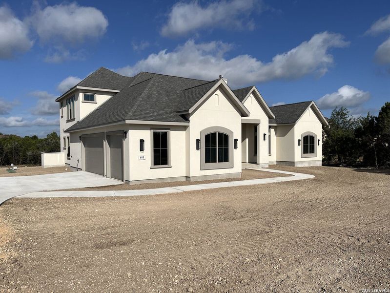 Front exterior of a new home in , Canyon Lake, TX, highlighting curb appeal (Image 21). Front exterior of a new home in , Canyon Lake, TX, highlighting curb appeal (Image 21).
