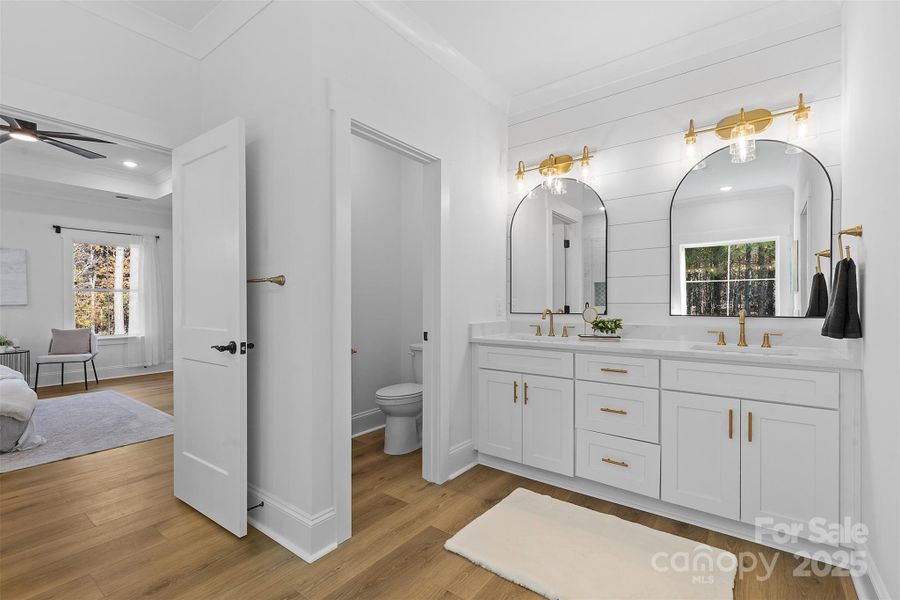 *representative photo- primary ensuite full bath w/ tub, frameless custom tiled shower, separate commode room