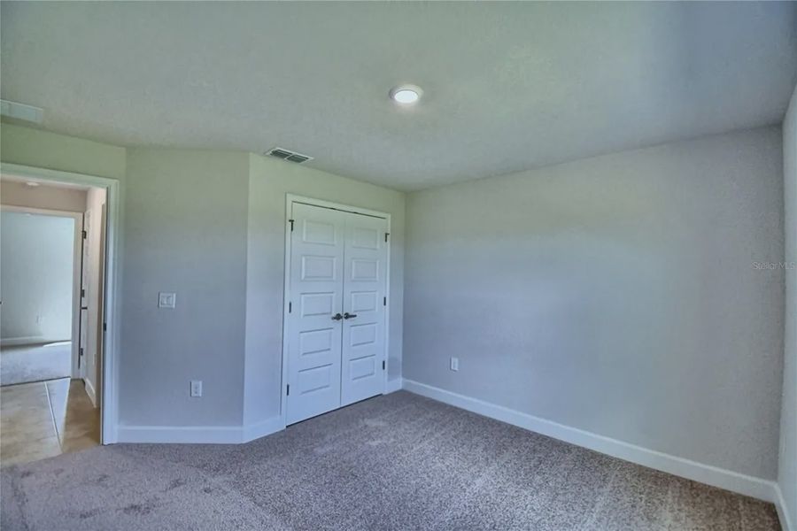 Spacious, unfurnished interior of a new home in Cadence Crossing, Auburndale (Image 24).