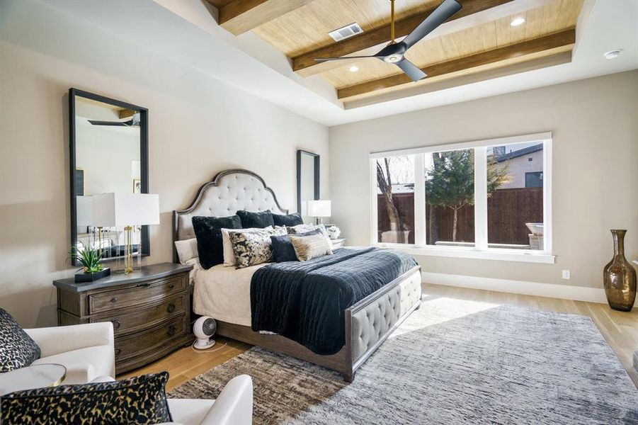 Primary Bedroom featuring wood ceiling, light hardwood flooring