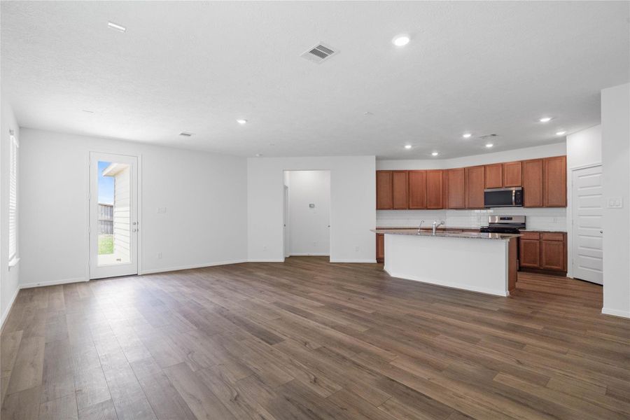 Designed for effortless living and entertaining, this bright open-concept layout seamlessly connects the living, dining, and kitchen spaces. Designed for effortless living and entertaining, this bright open-concept layout seamlessly connects the living, dining, and kitchen spaces.
