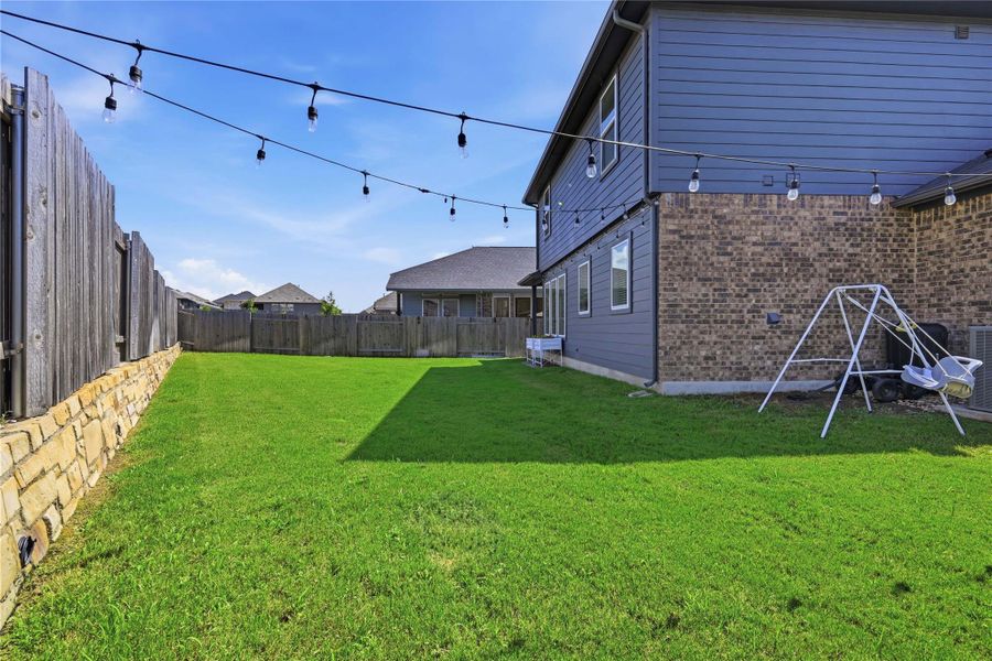 Exterior details and patio area of a home in Sunfield, Buda (Image 23).