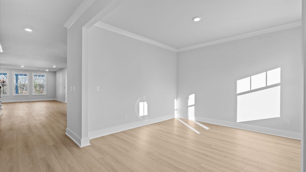 Functional flex room with tasteful hardwood floors and exceptional natural light in a modern home