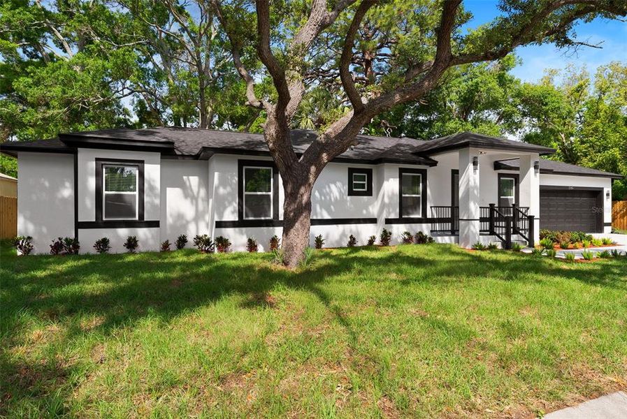 Front exterior of a new home in , St. Petersburg, FL, highlighting curb appeal (Image 24).