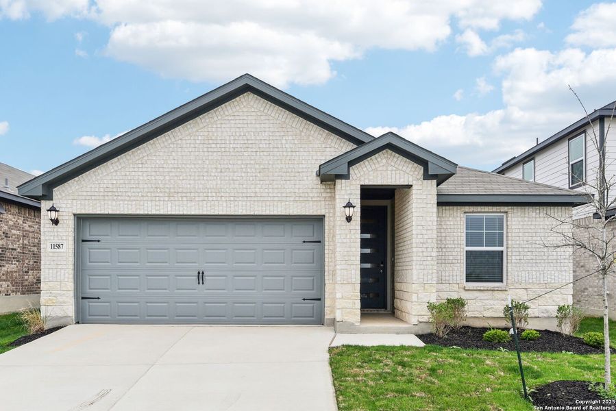 Front exterior of a new home in Sagebrooke - Premier Series, San Antonio, TX, highlighting curb appeal (Image 23).