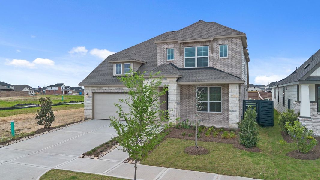 Front exterior of a new home in Austin Point, Richmond, TX, highlighting curb appeal (Image 23).