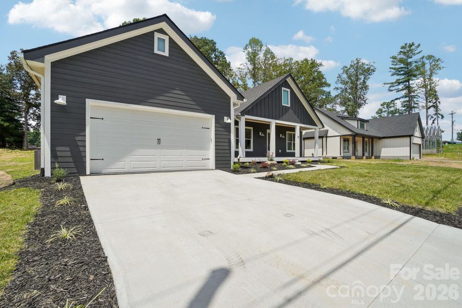 Front exterior of a new home in , Hendersonville, NC, highlighting curb appeal (Image 23).