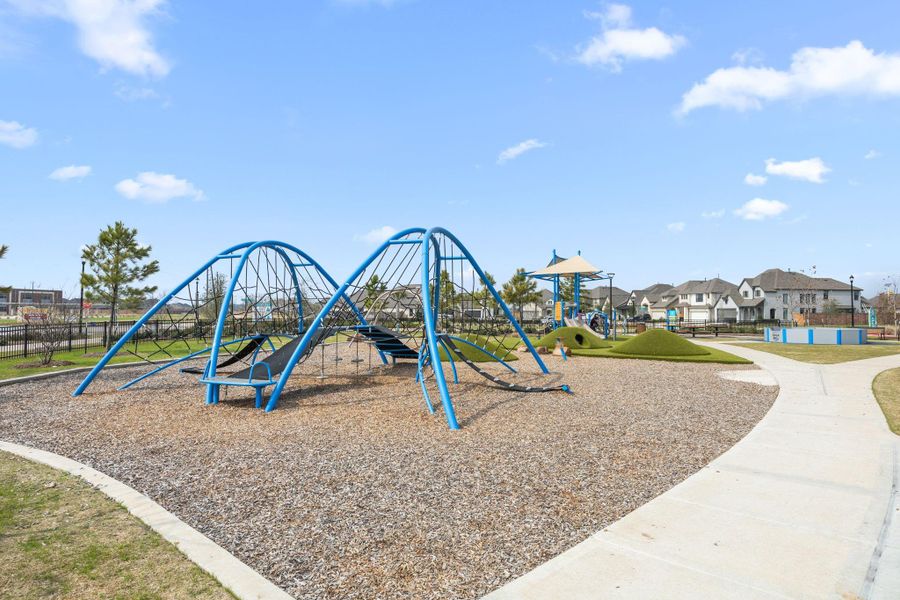 An additional park space offers rope climbing structures, turf mounds, and walking paths throughout the neighborhood.
