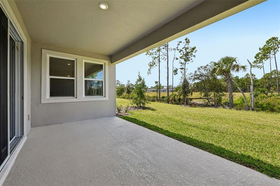 Exterior details and patio area of a home in Ridgehaven - Reserve Series, Ormond Beach (Image 3).