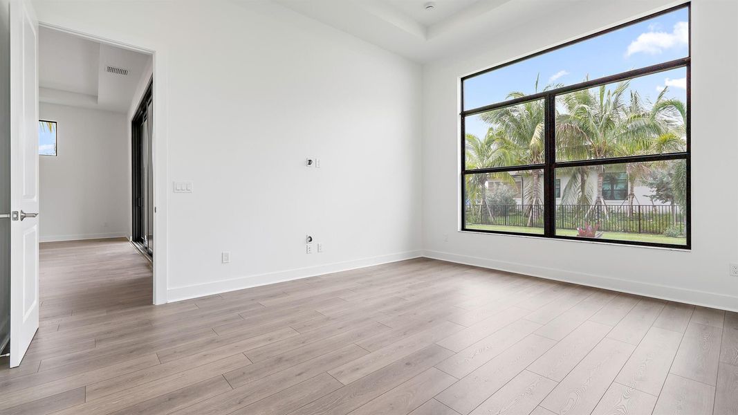 Spacious, unfurnished interior of a new home in L'Ambiance at Avenir, Palm Beach Gardens (Image 18).