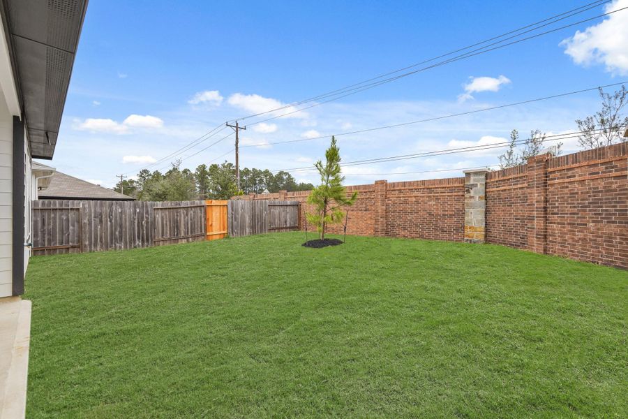 Exterior details and patio area of a home in Presswoods, Splendora (Image 3).