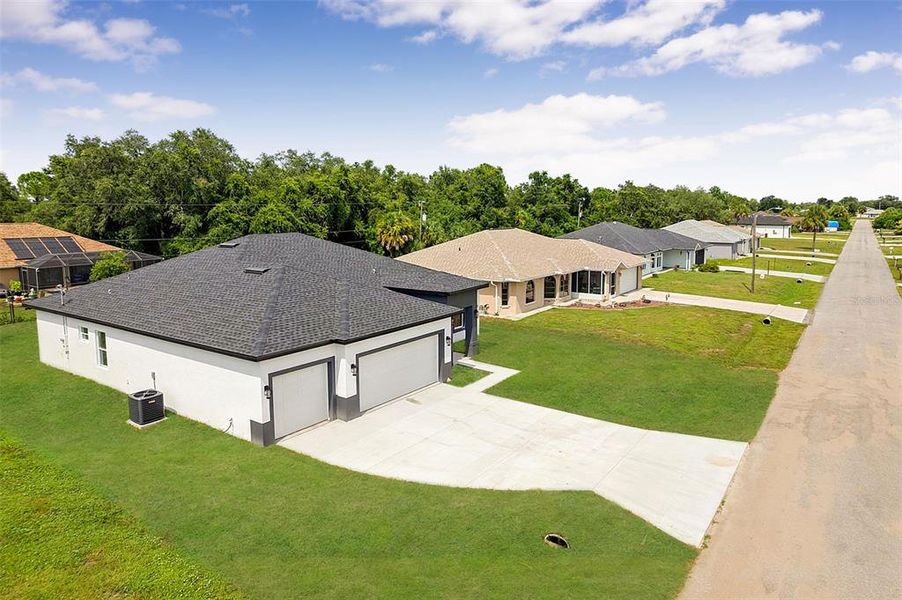 Front exterior of a new home in , North Port, FL, highlighting curb appeal (Image 1). Front exterior of a new home in , North Port, FL, highlighting curb appeal (Image 1).