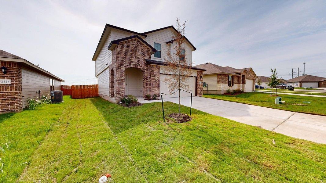Front exterior of a new home in Pecan Creek, Temple, TX, highlighting curb appeal (Image 17).