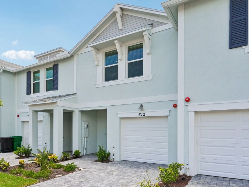 Front exterior of a new home in Tidewater, Fort Pierce, FL, highlighting curb appeal (Image 16).