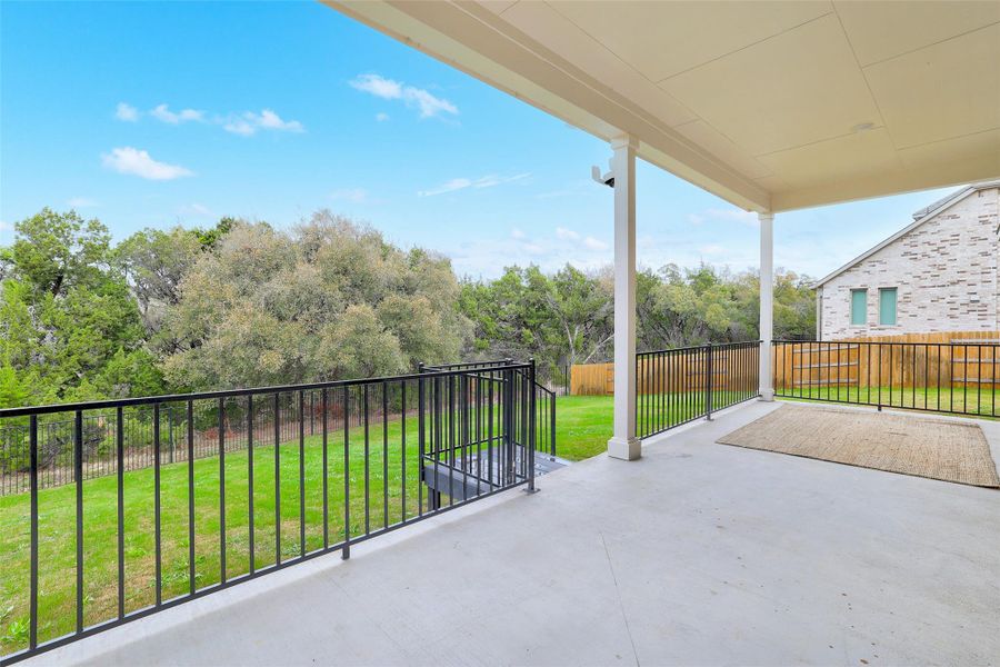 Fenced backyard featuring a patio