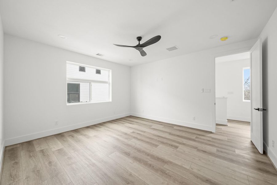 The space is thoughtfully designed with recessed lighting, a modern ceiling fan and is fully pre-wired for a flat screen TV. The space is thoughtfully designed with recessed lighting, a modern ceiling fan and is fully pre-wired for a flat screen TV.