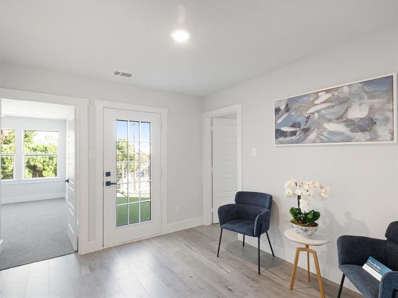 Living area featuring light hardwood / wood-style floors and plenty of natural light