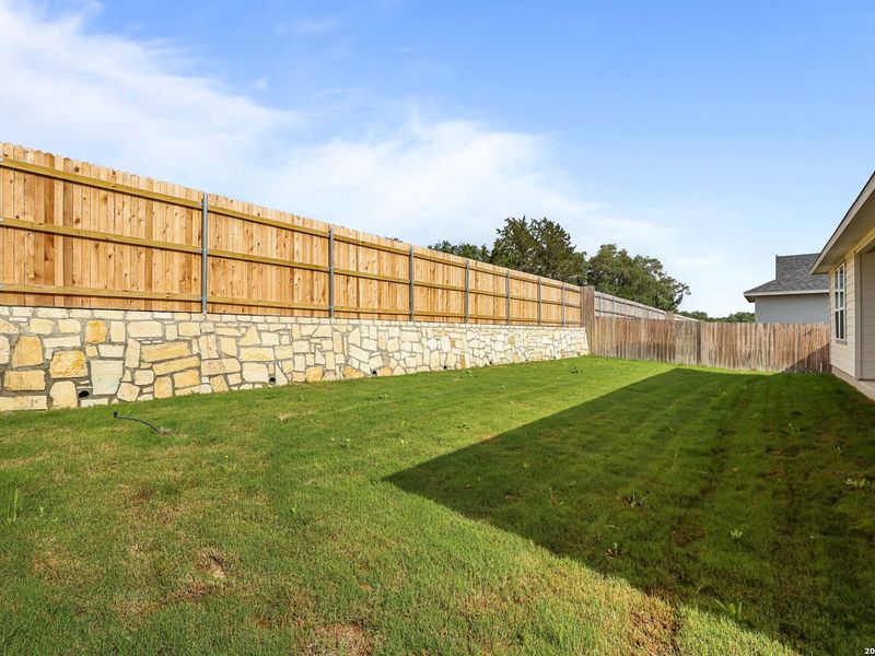 Exterior details and patio area of a home in The Reserve at Potranco Oaks, Castroville (Image 28).