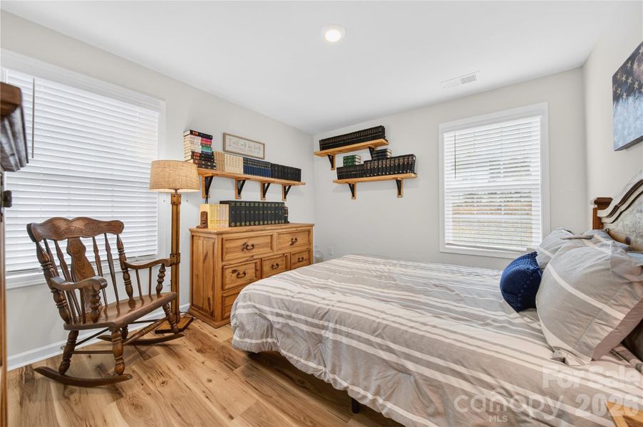 Bedroom 4 is on the back of the home overlooking the fenced backyard.