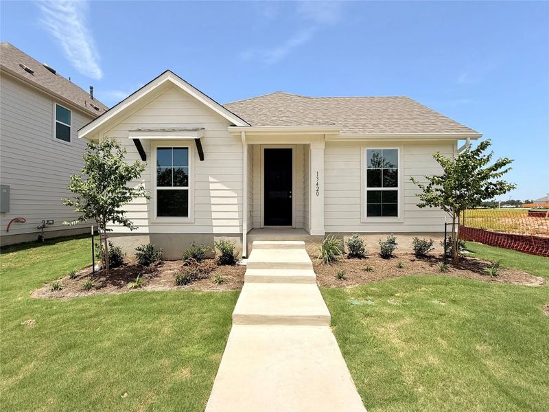 Bungalow featuring a shingled roof Bungalow featuring a shingled roof