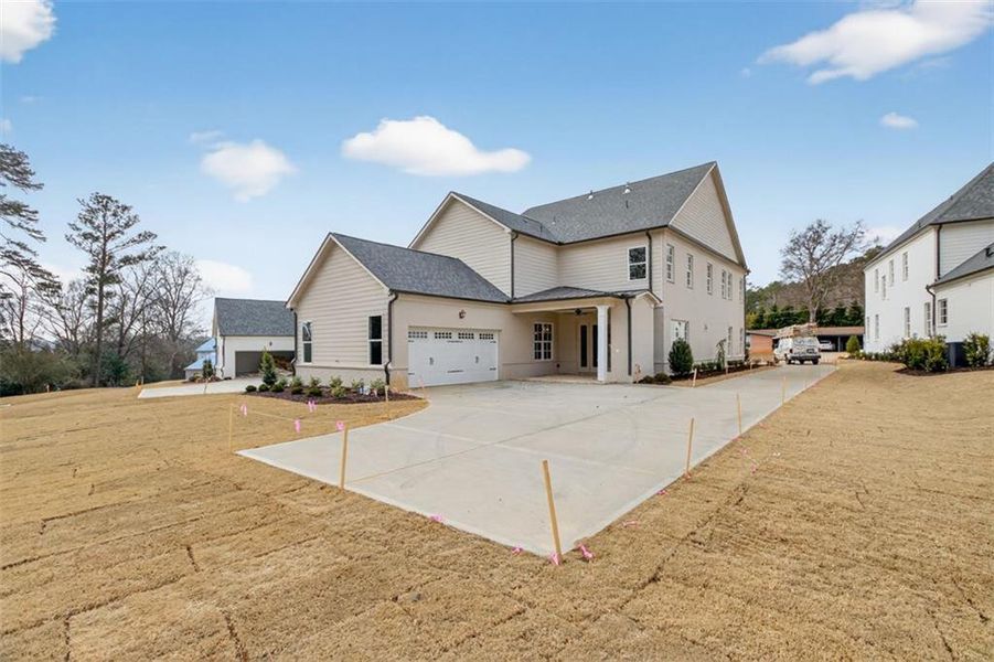 Front exterior of a new home in , Suwanee, GA, highlighting curb appeal (Image 30).