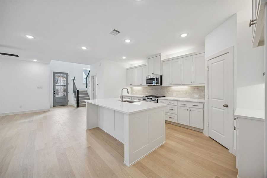 The chef in the family will never be left out of the party in this gorgeous home!