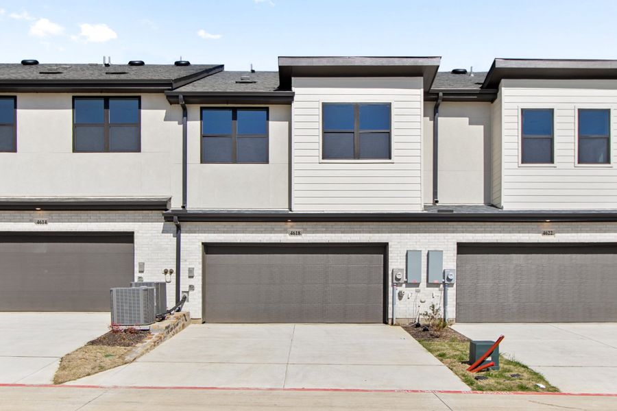 Front exterior of a new home in Wildridge, Oak Point, TX, highlighting curb appeal (Image 25).