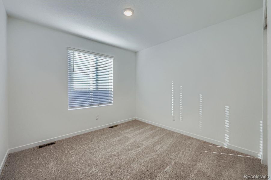 Spacious, unfurnished interior of a new home in Percheron: The Explorer Collection, Colorado Springs (Image 5).