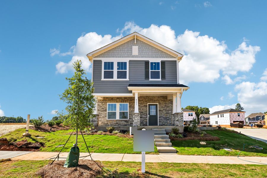 Front exterior of a new home in Avalon, Gastonia, NC, highlighting curb appeal (Image 1). Front exterior of a new home in Avalon, Gastonia, NC, highlighting curb appeal (Image 1).