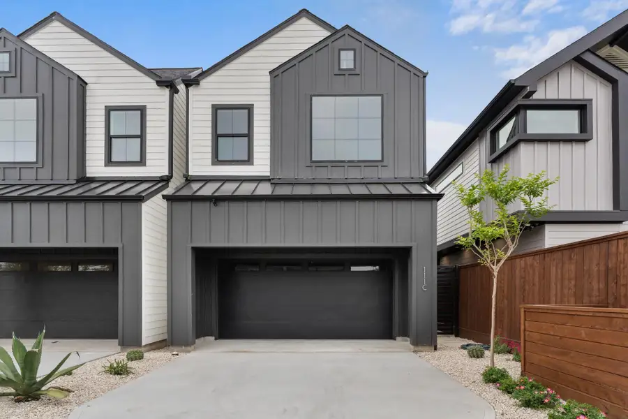 Striking contemporary design featuring professional landscaping, an elegant concrete driveway, and artfully arranged stepping stone pathways that welcome you home. Striking contemporary design featuring professional landscaping, an elegant concrete driveway, and artfully arranged stepping stone pathways that welcome you home.