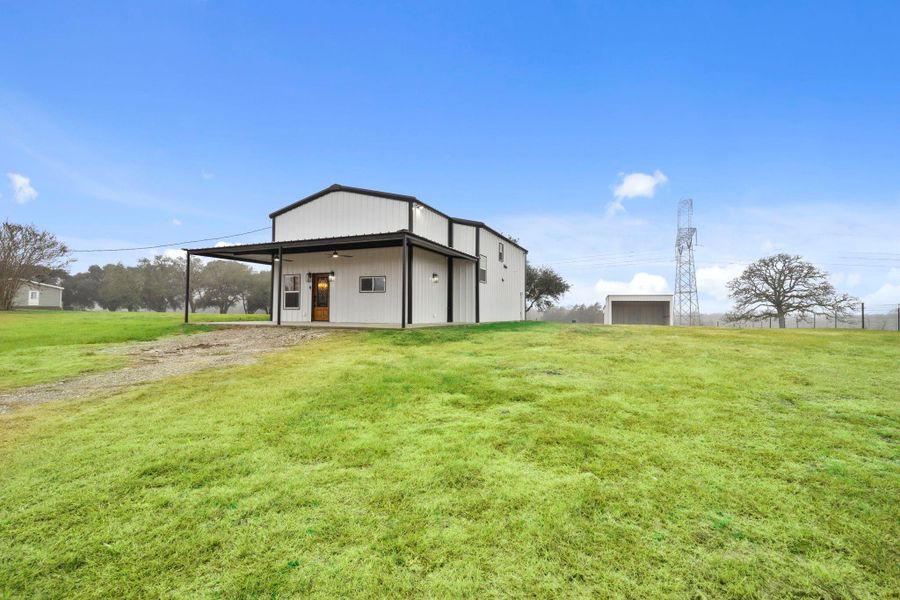 Set on a wide-open, level green lot bordered by mature trees, this property offers the peace, quiet, and space you’ve been dreaming of.