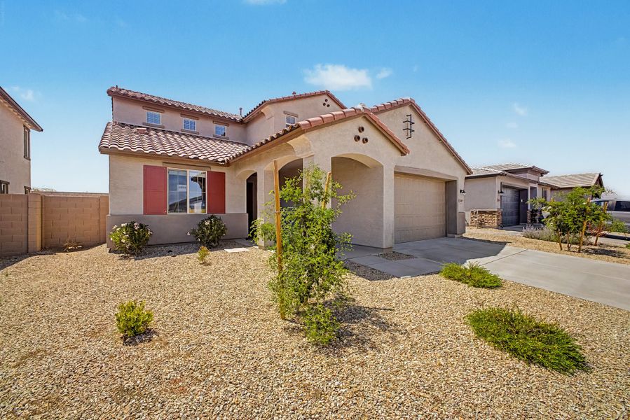 Front exterior of a new home in Frontera, Surprise, AZ, highlighting curb appeal (Image 2). Front exterior of a new home in Frontera, Surprise, AZ, highlighting curb appeal (Image 2).