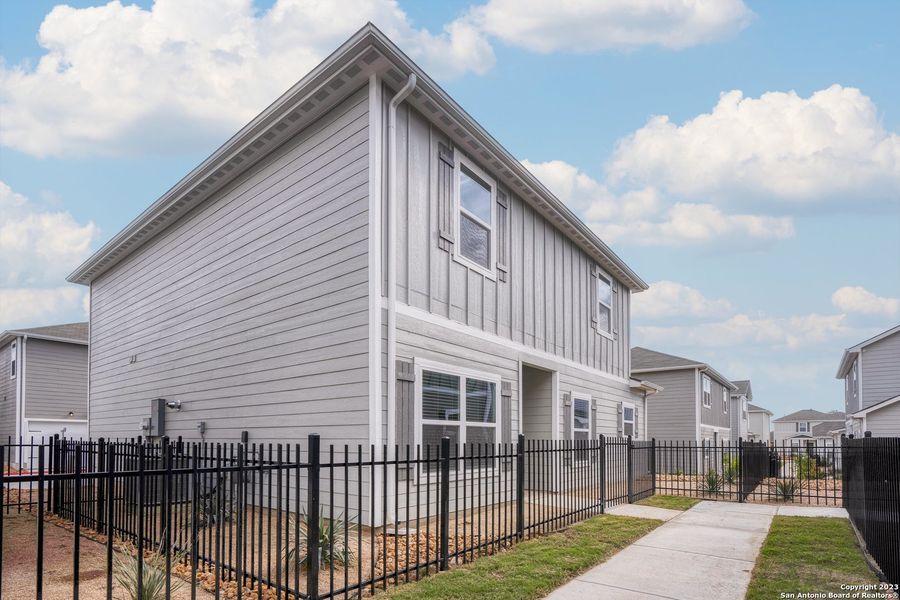 Front exterior of a new home in Luckey Ranch, San Antonio, TX, highlighting curb appeal (Image 1).