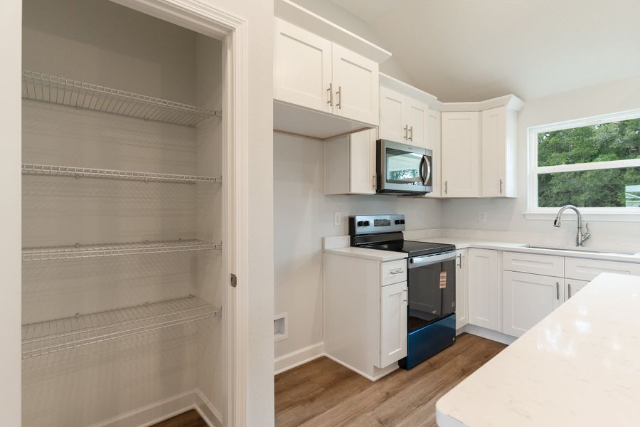 Furnished interior view inside a new home in Southern Charm, Crestview (Image 8). Furnished interior view inside a new home in Southern Charm, Crestview (Image 8).