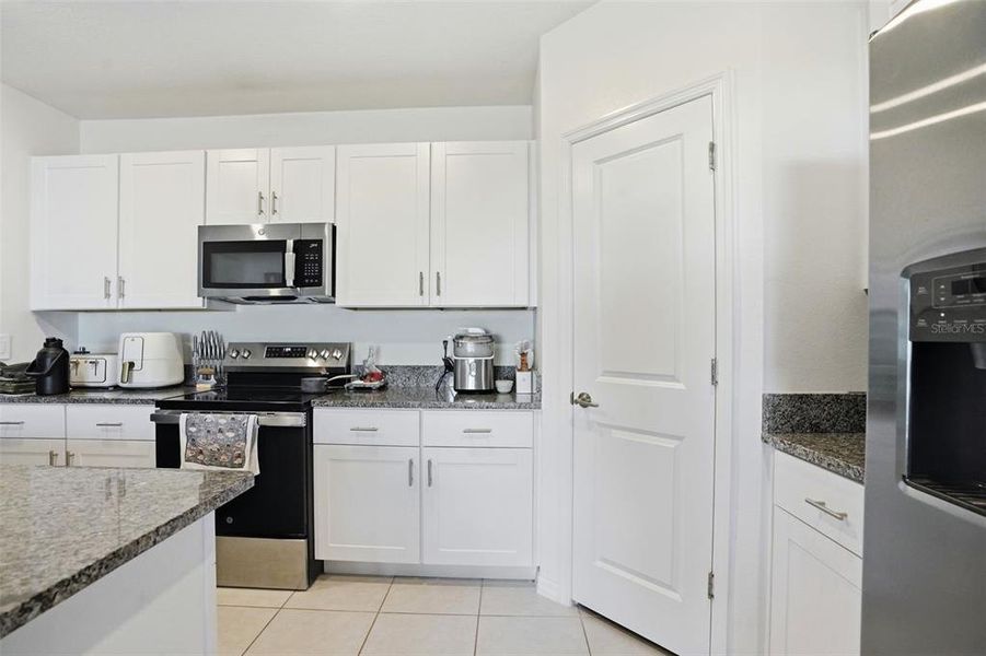 Furnished interior view inside a new home in The Isle of Avalon, Spring Hill (Image 13).