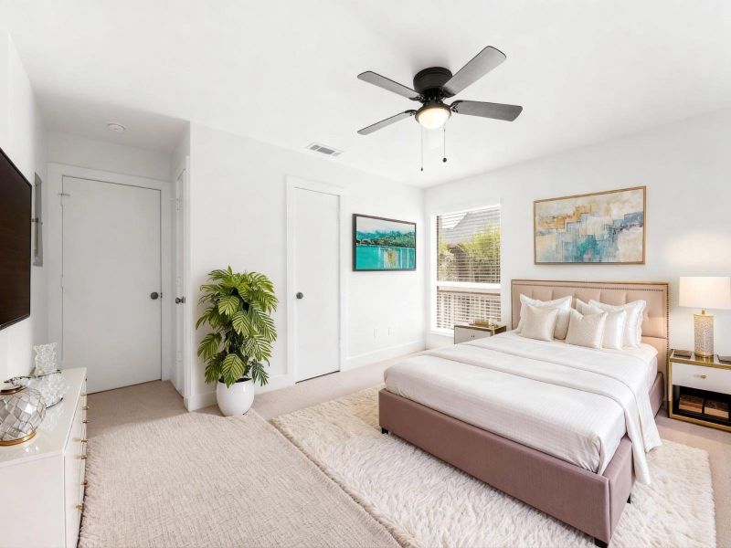 View of the spacious primary suite, virtually staged View of the spacious primary suite, virtually staged