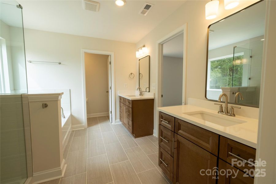 Two Quartz topped Vanities and Commode Room
