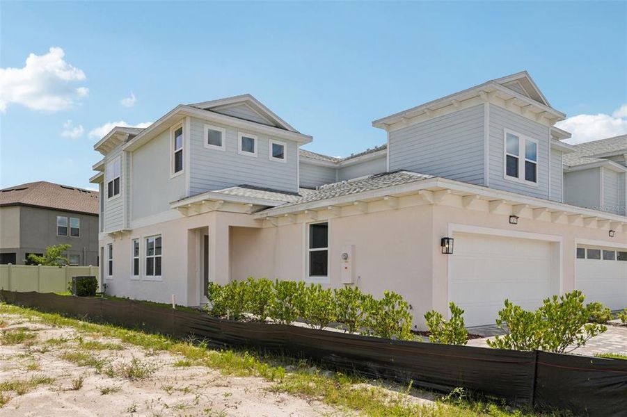 Front exterior of a new home in Lagoon Residences at Epperson, Wesley Chapel, FL, highlighting curb appeal (Image 2).