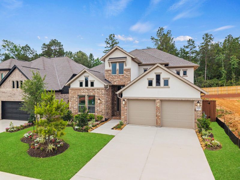 Front exterior of a new home in Wildtree, Magnolia, TX, highlighting curb appeal (Image 2). Front exterior of a new home in Wildtree, Magnolia, TX, highlighting curb appeal (Image 2).