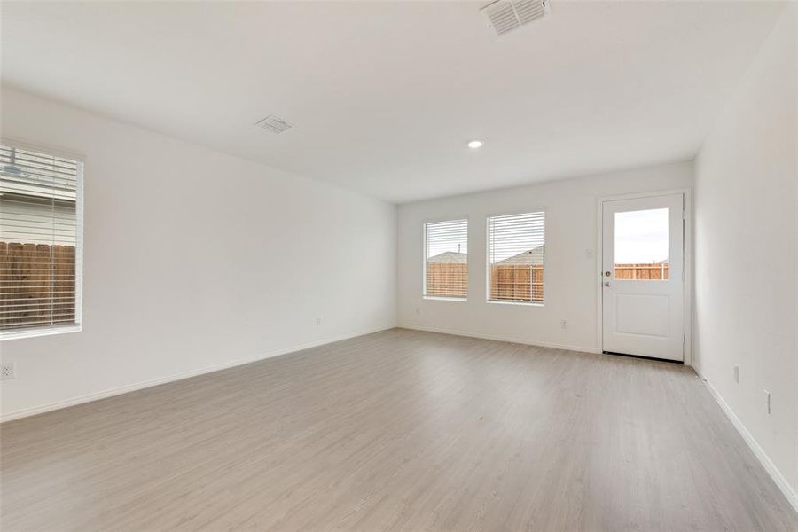 Unfurnished room with light hardwood / wood-style floors