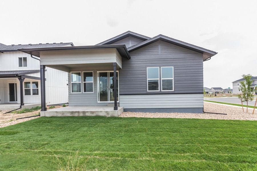 Exterior details and patio area of a home in Prairie Song, Windsor (Image 36).