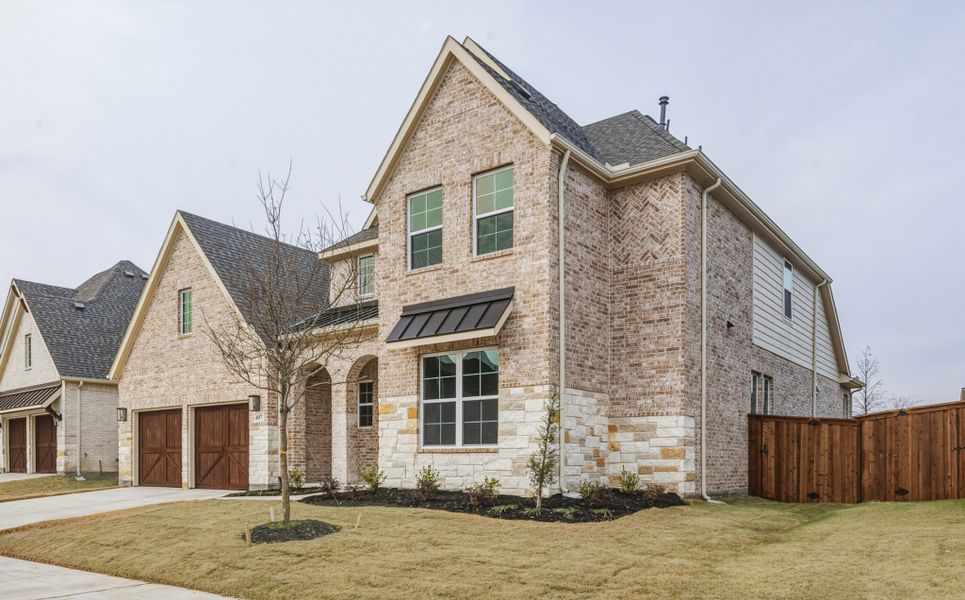 Front exterior of a new home in Edgewater, Fate, TX, highlighting curb appeal (Image 21).
