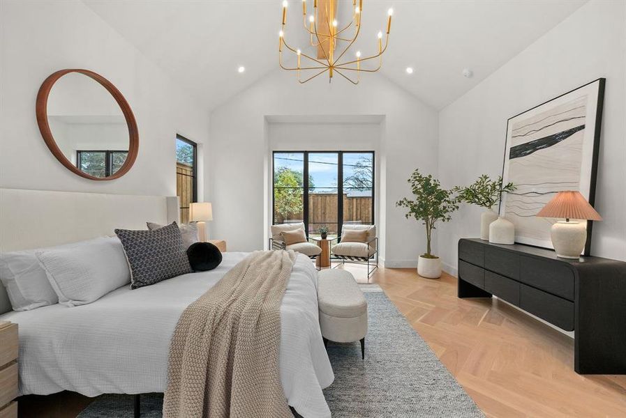 Bedroom with parquet floors, a chandelier, high vaulted ceiling, access to exterior, and recessed lighting Bedroom with parquet floors, a chandelier, high vaulted ceiling, access to exterior, and recessed lighting