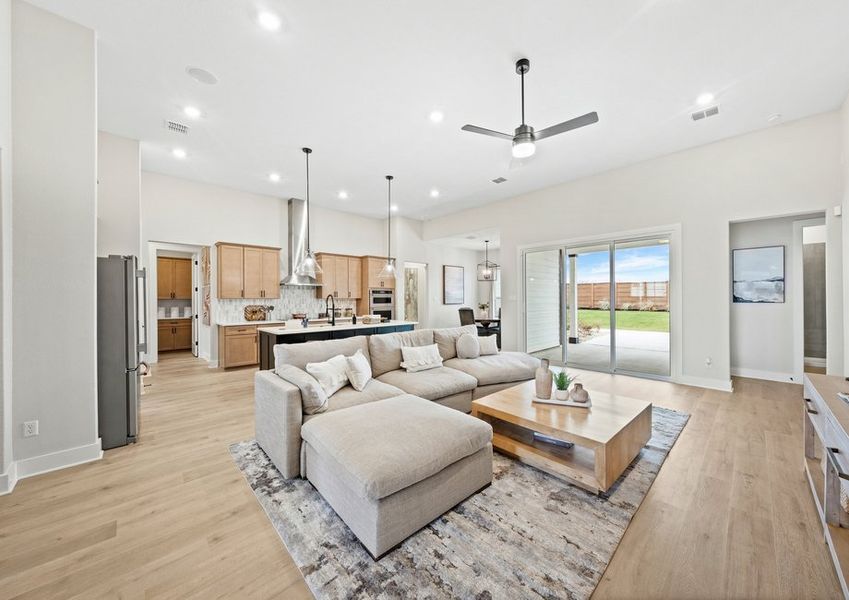 The open layout connects the kitchen, breakfast nook. dining room and family room.