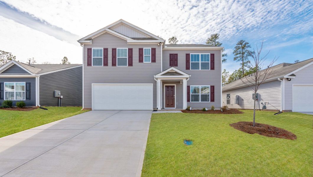 Front exterior of a new home in Lakestone, Woodruff, SC, highlighting curb appeal (Image 1).